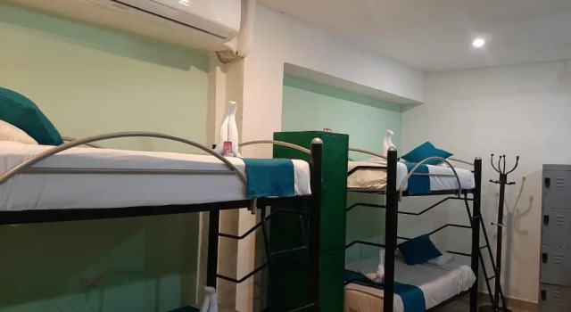 Кровать в общем номере Hotel Casa Fernanda