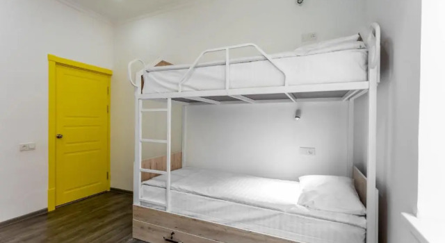 Łóżko w pokoju wieloosobowym Registan Hostel