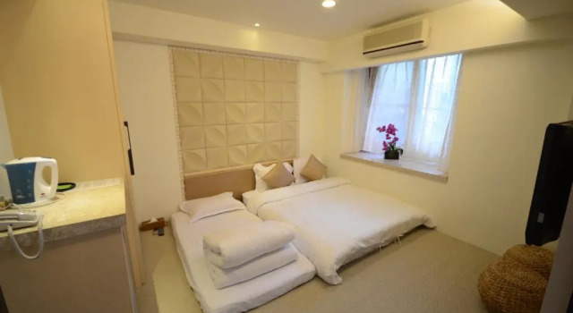 Standard triplaágyas szoba a hegyre néző kilátással Mingao spring hotel