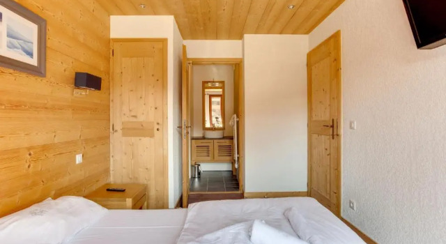 Кровать в общем номере с 2 комнатами Dormio Resort Les Portes du Mont Blanc