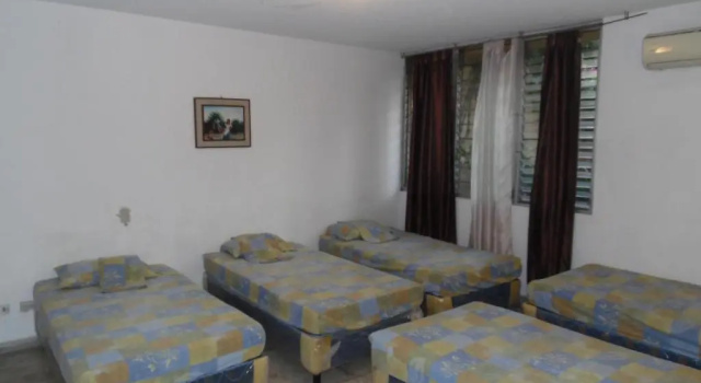 Кровать в общем номере Hostal Cumbres de El Salvador