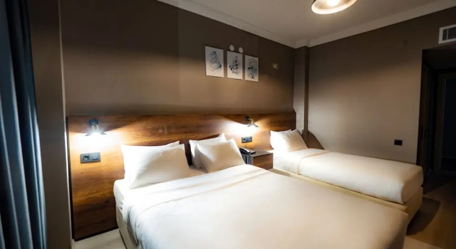Standardowy czteroosobowy pokój Dogme Hotel