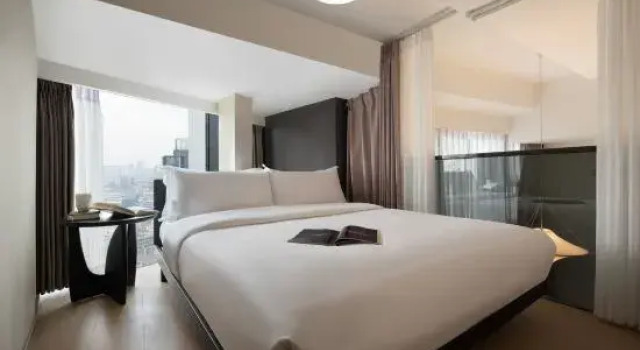 Люкс Deluxe с 2 комнатами Yiyu Swimming Pool Hotel (Wu Yi Square IFS)