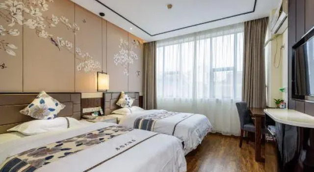 Junyi Hotel, Забронировать Отель Хэчи Гуанси-Чжуанский автономный район