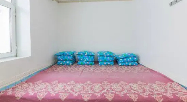 Кровать в общем номере Xuegu Mahua Inn (China Xuegu Scenic Area Branch)