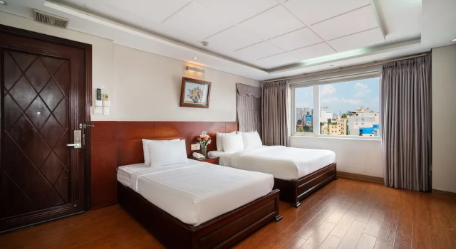 Трёхместный номер Deluxe Van Ha Hotel Etown - Nhà Ga T3 Sân Bay TSN
