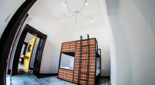 Кровать в общем номере Gente de Más Bnb