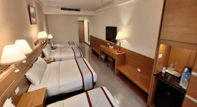 Кровать в общем номере Cheng Pao Hotel