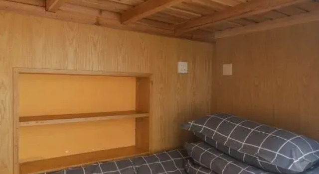 Кровать в общем номере Xidi Huaxipan YouthHostel