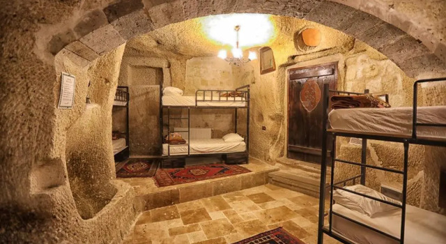 Кровать в общем номере Göreme Cave Suites