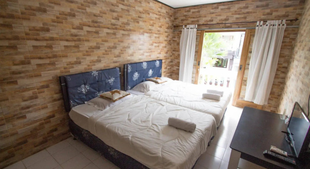 Clamonic Guest House, Boek Pension Benoa Bali