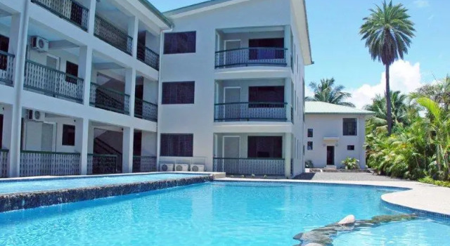 Кровать в общем номере Hexagon International Hotel, Villas & Spa