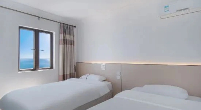 Люкс с 2 комнатами с видом на море Shuangyuewan Yikela Holiday Apartment