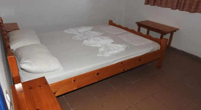 Четырёхместный номер Standard с балконом NIKOS APARTMENTS