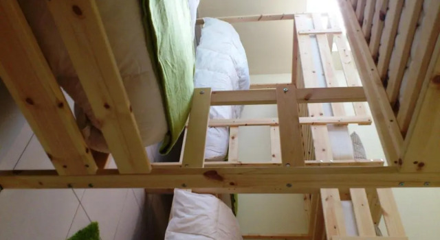 Кровать в общем номере SwissPorto Guest House