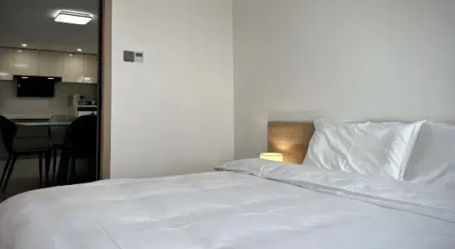 Двухместный люкс с 4 комнатами с видом на море Xitang Fushi Taofang Scenic Apartment (Liangan Jinrong Zhongxin)