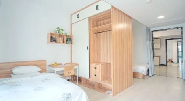 Bett im Wohnheim Liangfu Hotel