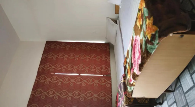 Кровать в общем номере Hotel Vacation