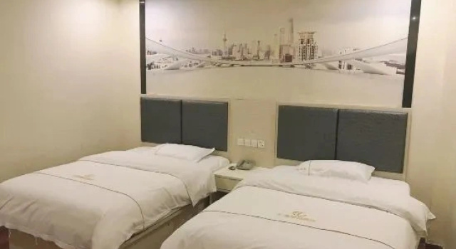 Двухместный семейный люкс Deluxe Huigang Boutique Hotel (Guangzhou North Railway Station Huaguoshan Park Subway Station)