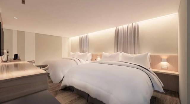 Кровать в общем номере Ta Lee Hotel