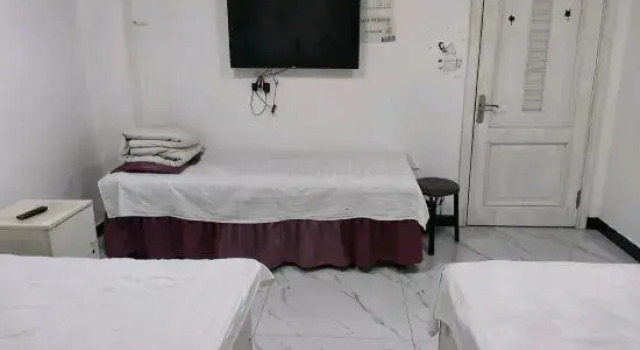 Кровать в общем номере Qiqihar Dadi Hotel