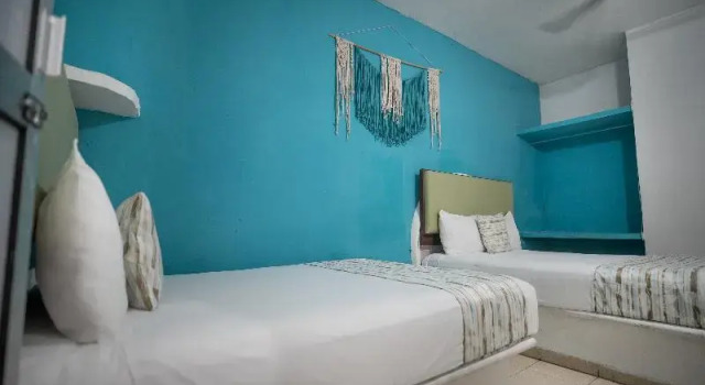 Кровать в общем номере Hotel Posada Aurora