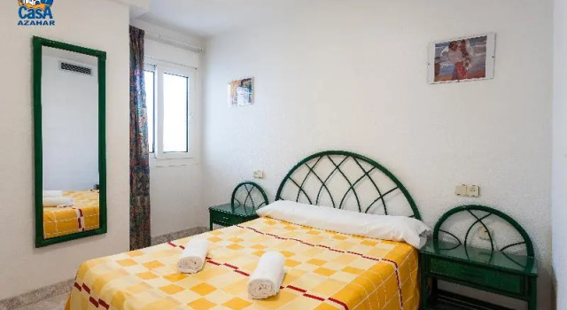Кровать в общем номере с 3 комнатами с балконом Residencial Casablanca Casa Azahar