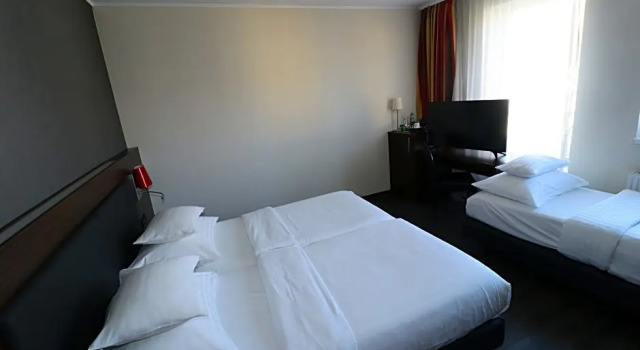 Четырёхместный номер Comfort PLAZA INN Graz City