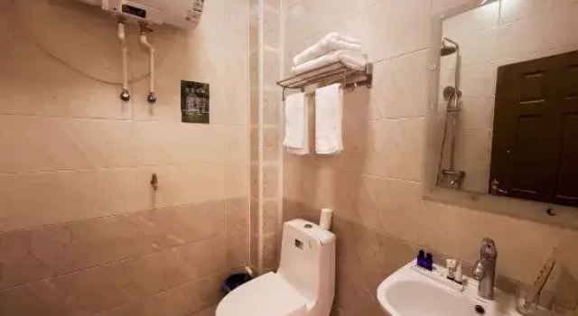 Кровать в общем номере Yabuli Qingyun County Xin Ding Apartment Hotel