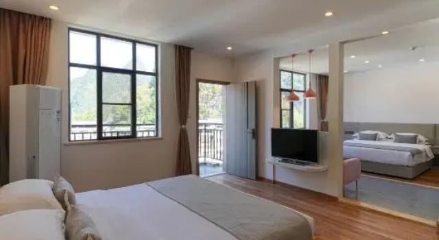 Четырёхместный семейный люкс с 2 комнатами Yueshanyueshui Vacation Apartment (Yangshuo Yulong River Xiatang Wharf)