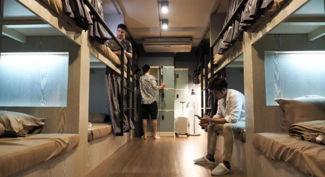 Кровать в общем номере TK mansion Hat Yai