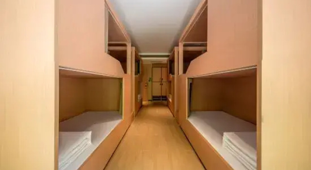 Кровать в общем номере Haoting Yunqi Hotel (Jiuzhaigou Valley Scenic and Historic Interest Area Scenic Spot Store)