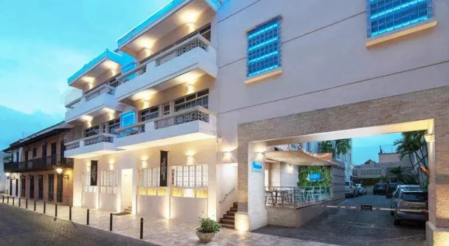 Кровать в общем номере Hodelpa Caribe Colonial