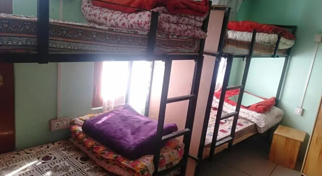 Кровать в общем номере Paradise Holiday Resort