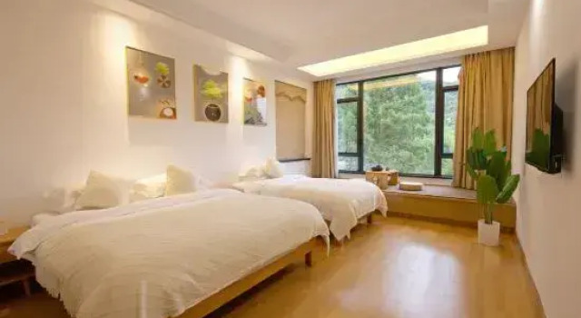 Кровать в общем номере Moganshan Zhuji Mountain Lodge