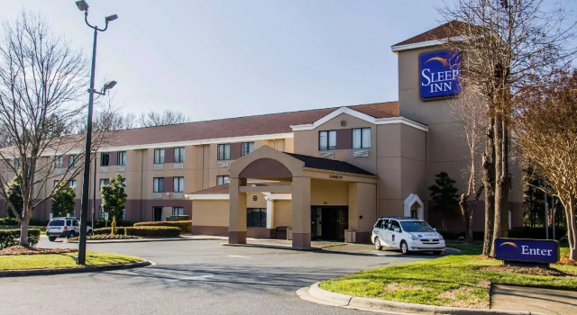 Кровать в общем номере Sleep Inn Airport - Billy Graham Parkway