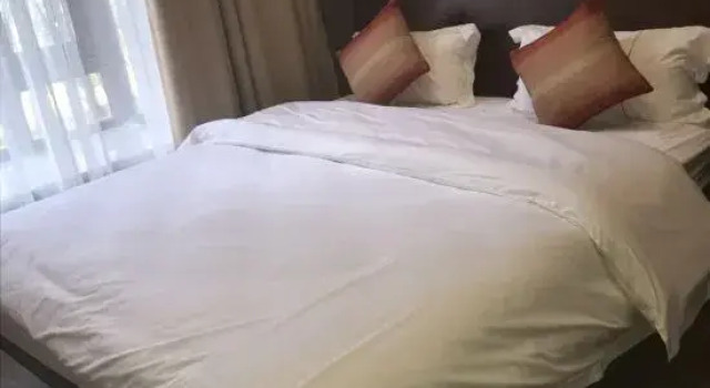 Люкс с 2 комнатами с видом на сад Yumi Holiday Apartment (Changjiang Qizi Bay)