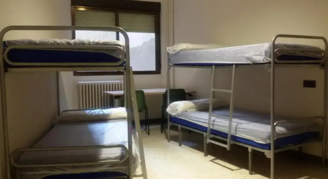 Кровать в общем номере Albergue Peregrinos San Francisco de Asis