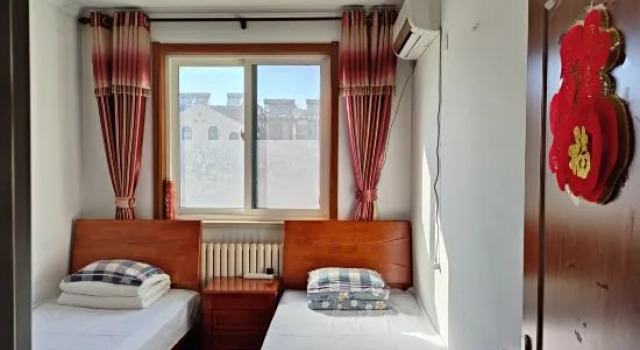 Люкс с 3 комнатами с видом на море Yijia B&B (Qingdao Jinshatan Branch)