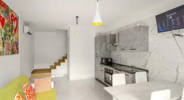 Апартаменты Elegant Apartment With Shared Pool