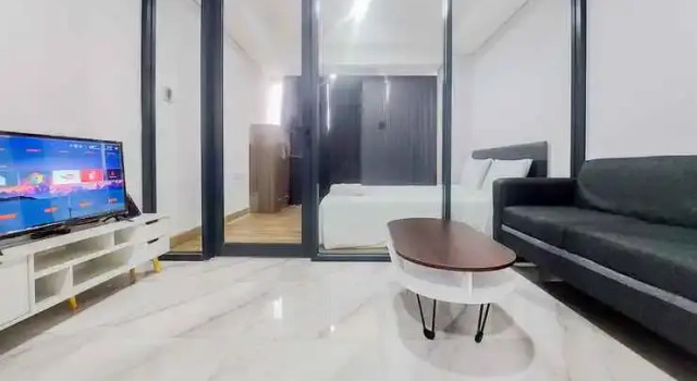 Comfort and Tranquil Living 1BR The Smith Alam Sutera Apartment By Travelio