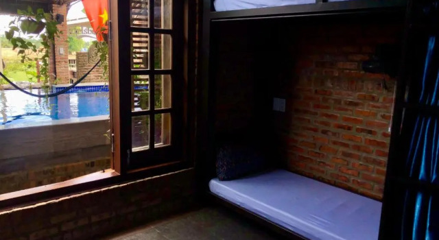 Кровать в общем номере Calm House Hotel Hoi An 1
