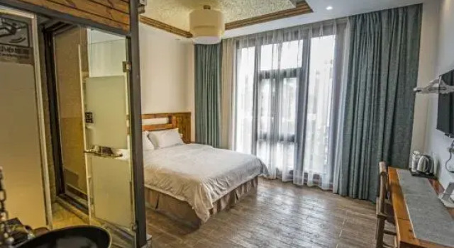 Muzijia Inn, Rezerwuj Hotel Hotele 3-gwiazdkowe w Libo, 3*