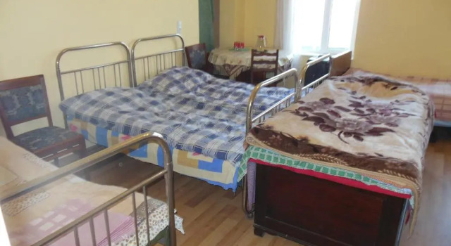 Кровать в общем номере Medico and Suliko Guest House