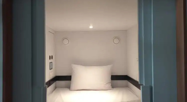Кровать в общем номере Nindya Biodistrict Hotel Bandung