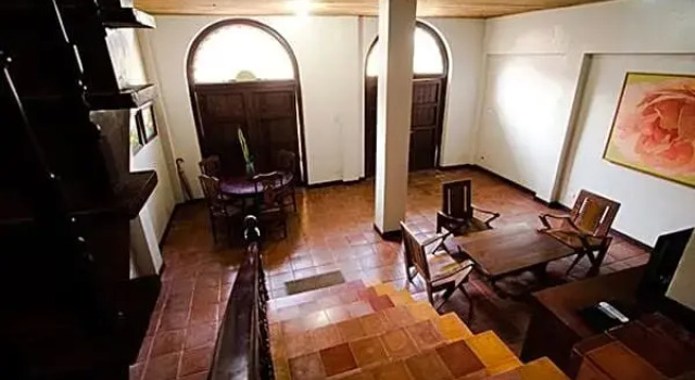 Кровать в общем номере Las Casas Filipinas de Acuzar