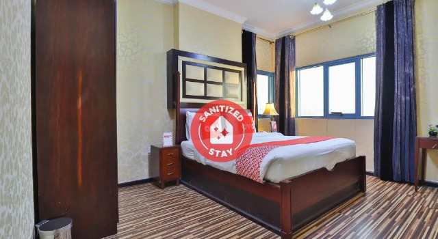 Кровать в общем номере Grand PJ Hotel