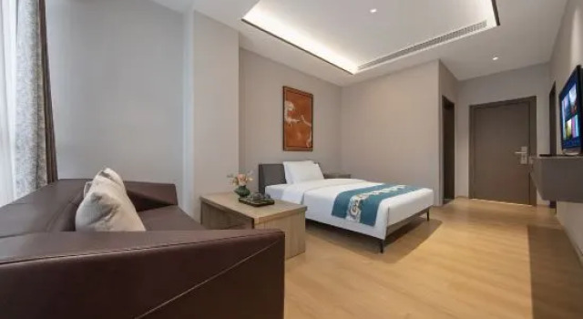 Семейный люкс Yuekelai Hotel Ruili