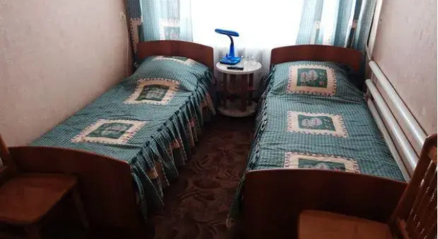 Кровать в общем номере Гостиница Юбилейная