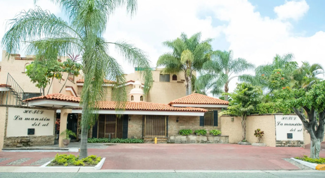 Кровать в общем номере Hotel La Mansion del Sol